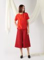 textured top with curved hem in red